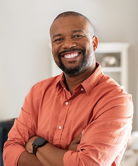 Man sharing healthy smile after tooth extraction