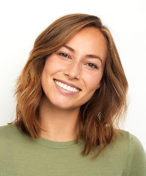 Happy woman enjoying the benefits of gummy smile correction