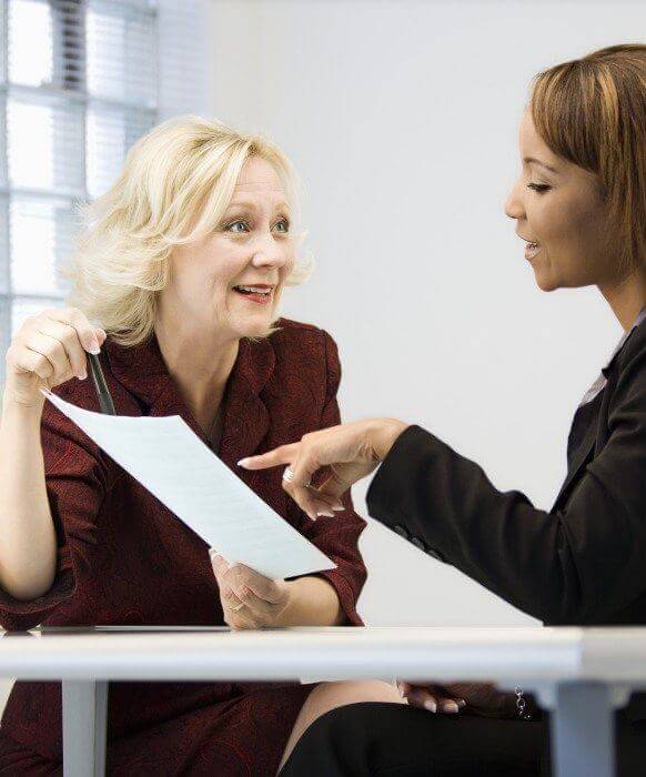 Periodontal patient talking to team member about treatment options