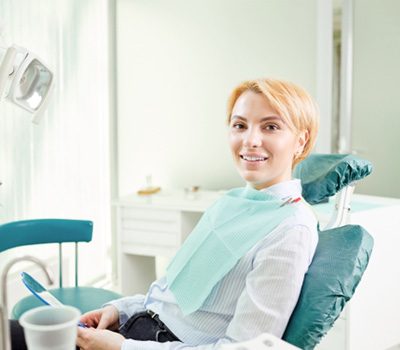 Female patient smiling before her procedure