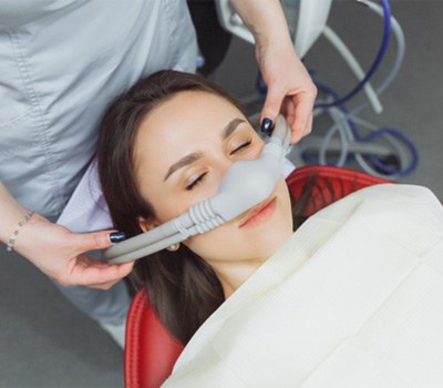 Female patient relaxing under effects of nitrous oxide sedation in Mayfield Heights, OH