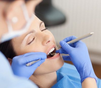 : a dental patient in Mayfield Heights giving a thumbs up