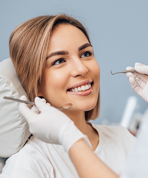 Patient smiling after periodontal surgery