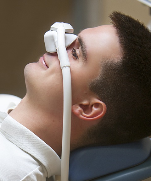 Man with nitrous oxide sedation dentistry mask