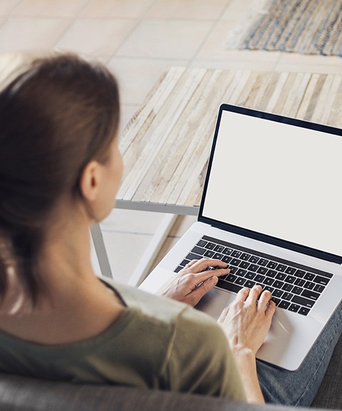 Woman typing an email to Docotor Jonathan Ross